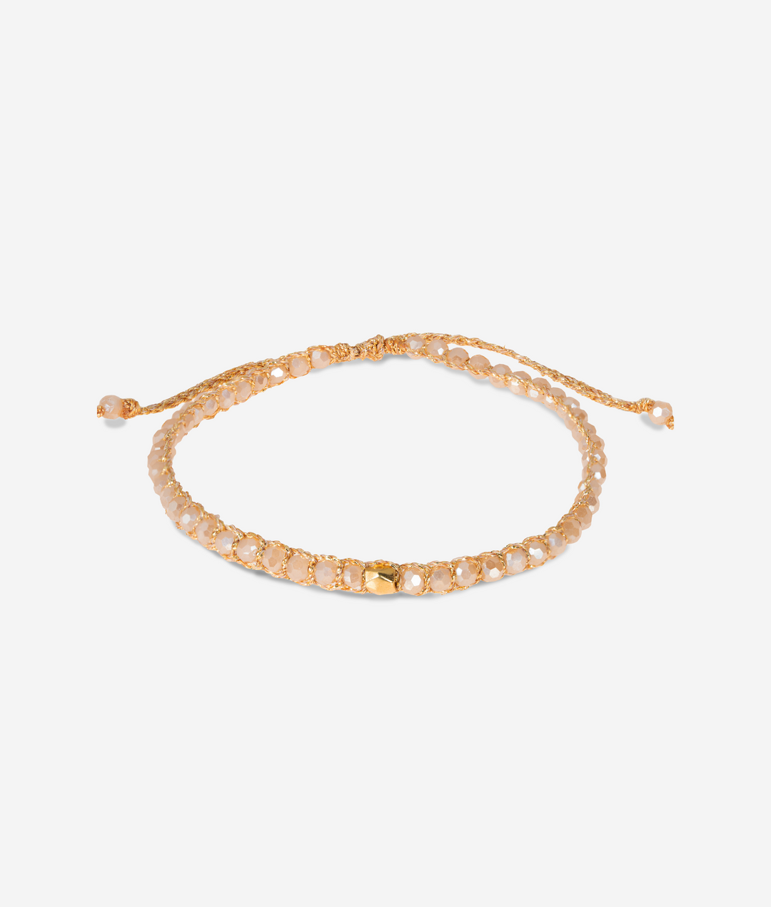 Gold champagne bracelet on a light gray background