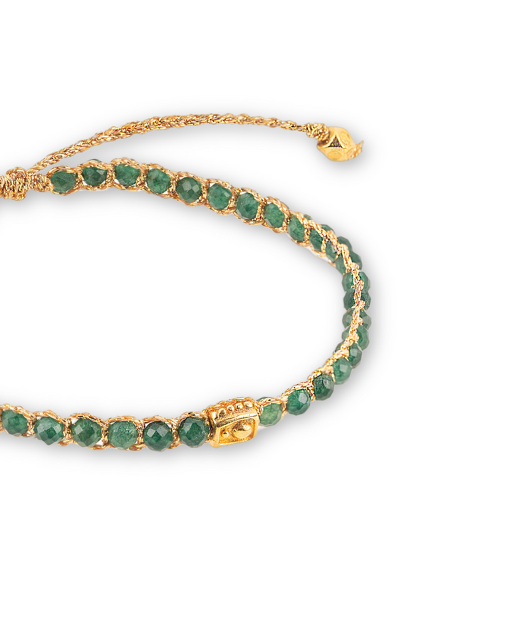 Green Emerald Crystal Gemstone Adjustable bracelet strung together with 18K Gold Yarn, close up view.