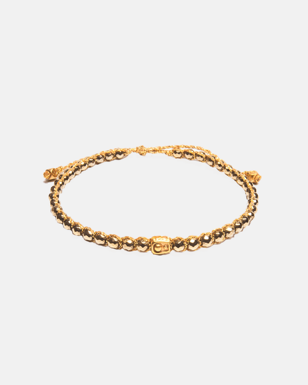 Gold gemstone bracelet on a white background