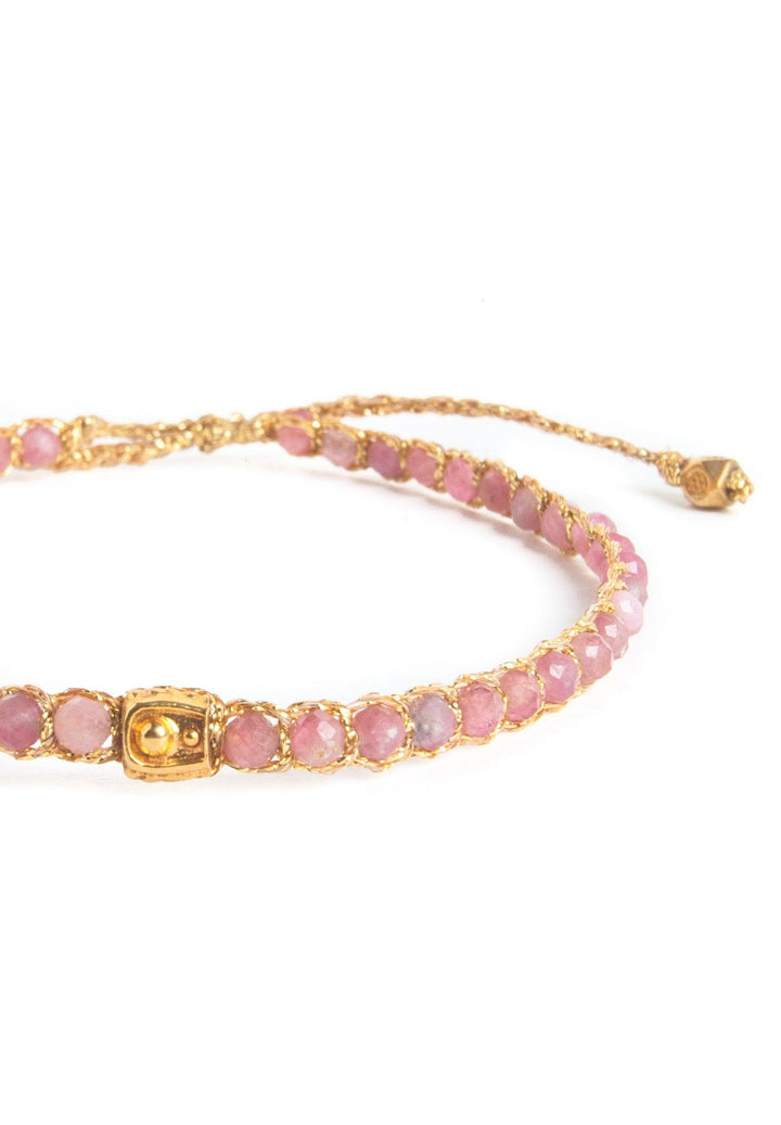 Pink Tourmaline Gemstone Adjustable bracelet strung together with 18K Gold Yarn, close up view.