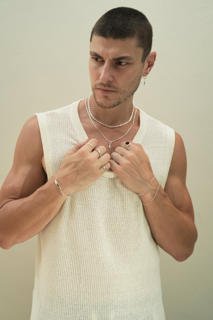 Founder of Nusands Corey Micari wearing a range of Sterling Silver bracelets, cuff, rings and necklaces with a close focus on the lightning bolt charm