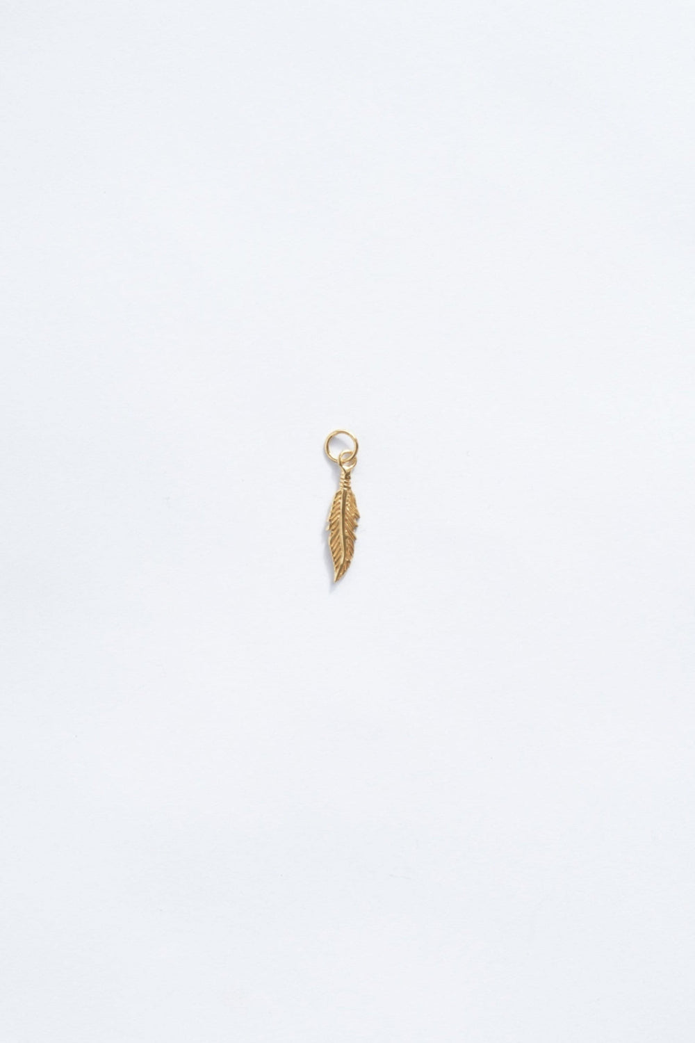 18k gold feather necklace charm zoomed out