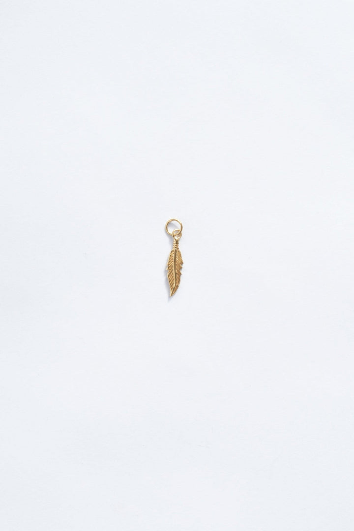 18k gold feather necklace charm zoomed out