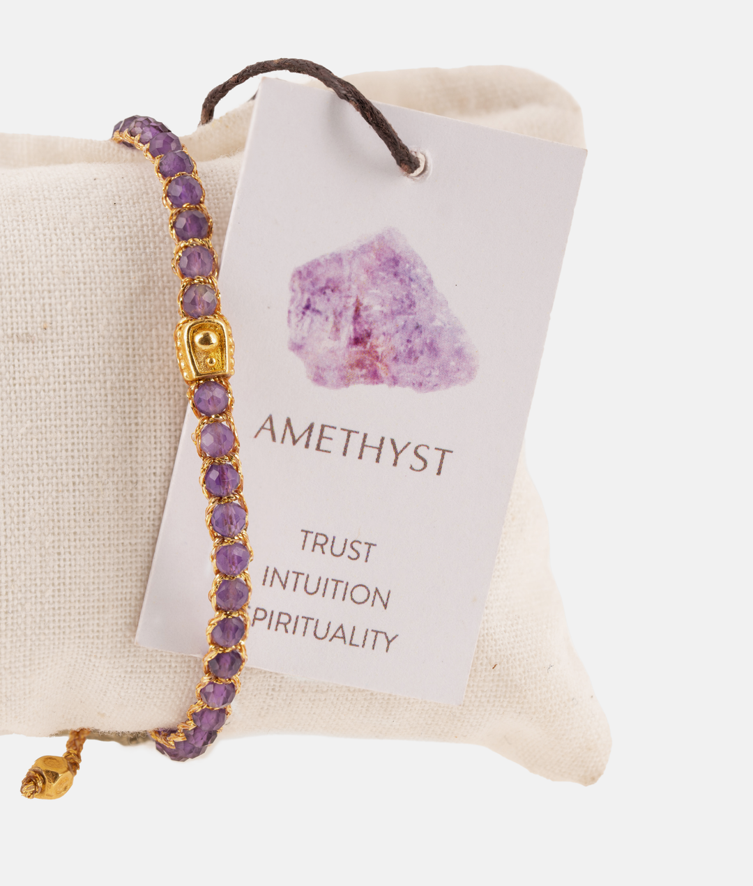 Amethyst Crystal Gemstone Adjustable bracelet covering white cushion strung together with 18K Gold Yarn, Information tag showing.