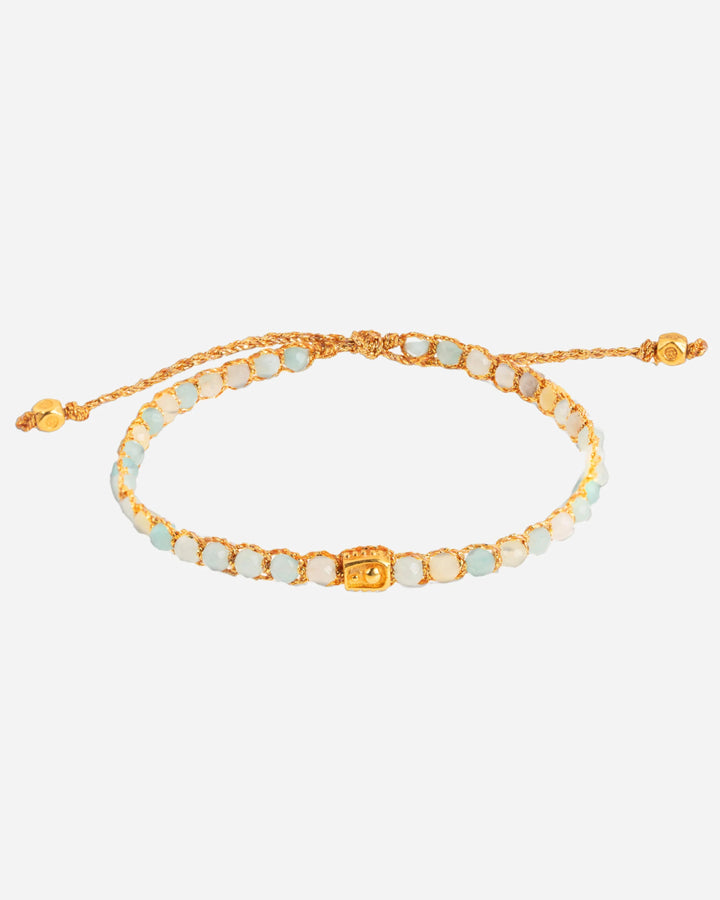 Aquamarine Crystal Gemstone Bracelet. Blue, white and gold crystals woven into 18k gold yarn.