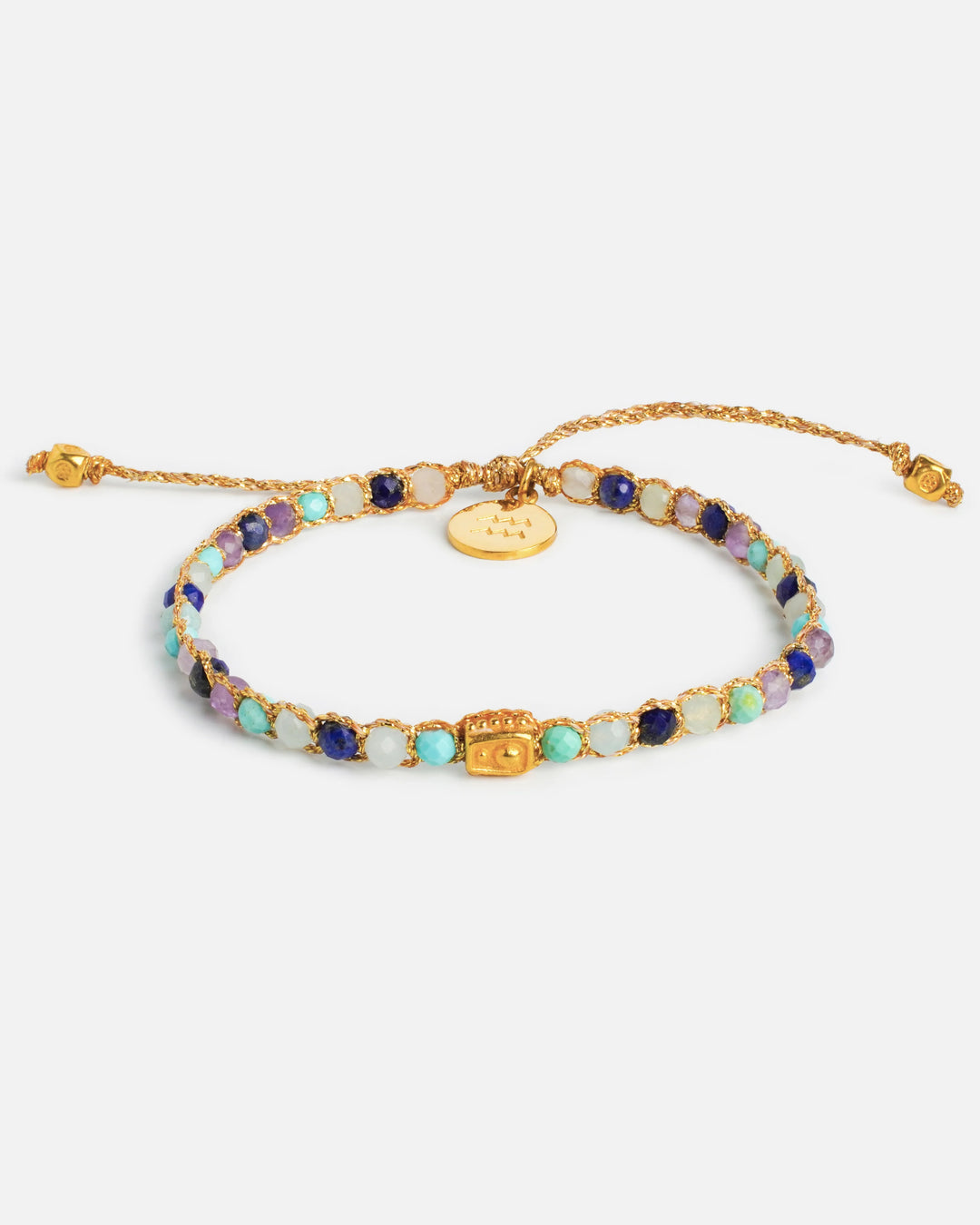 Aquarius Crystal Zodiac Gemstone Bracelet with blue, purple and clear gemstones woven in pure silver yarn and plated with 18k gold.