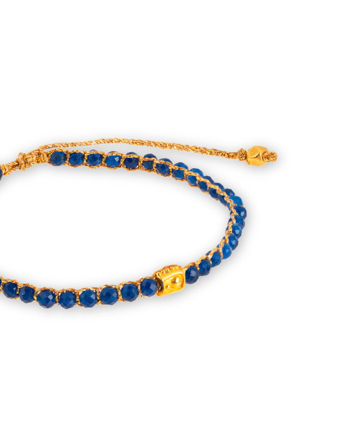 Blue Chalcedony Gemstone Adjustable bracelet strung together with 18K Gold Yarn, close up view.