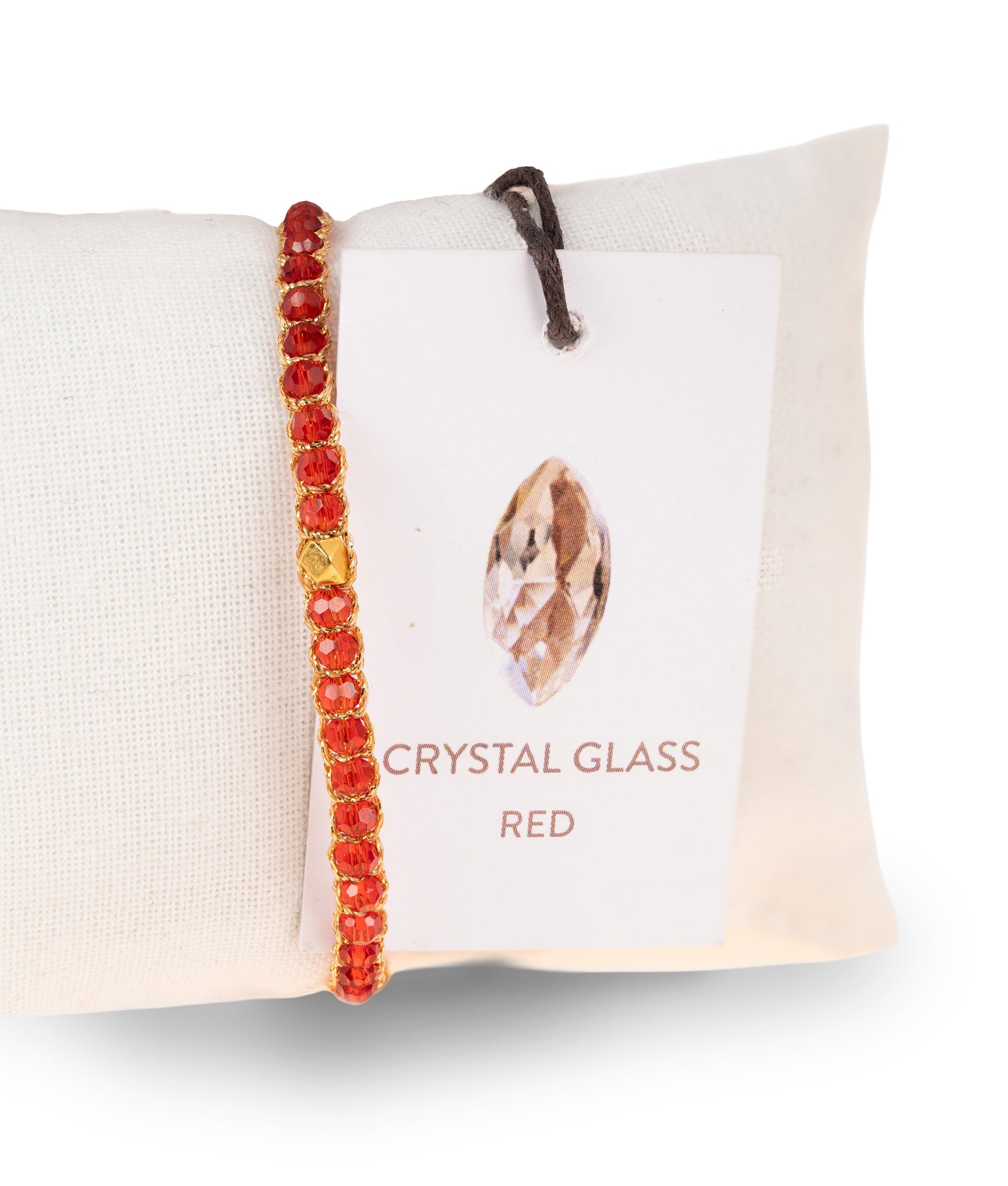 Gemstone bracelet with red beads on a branded card with 'Crystal Glass Red' text.