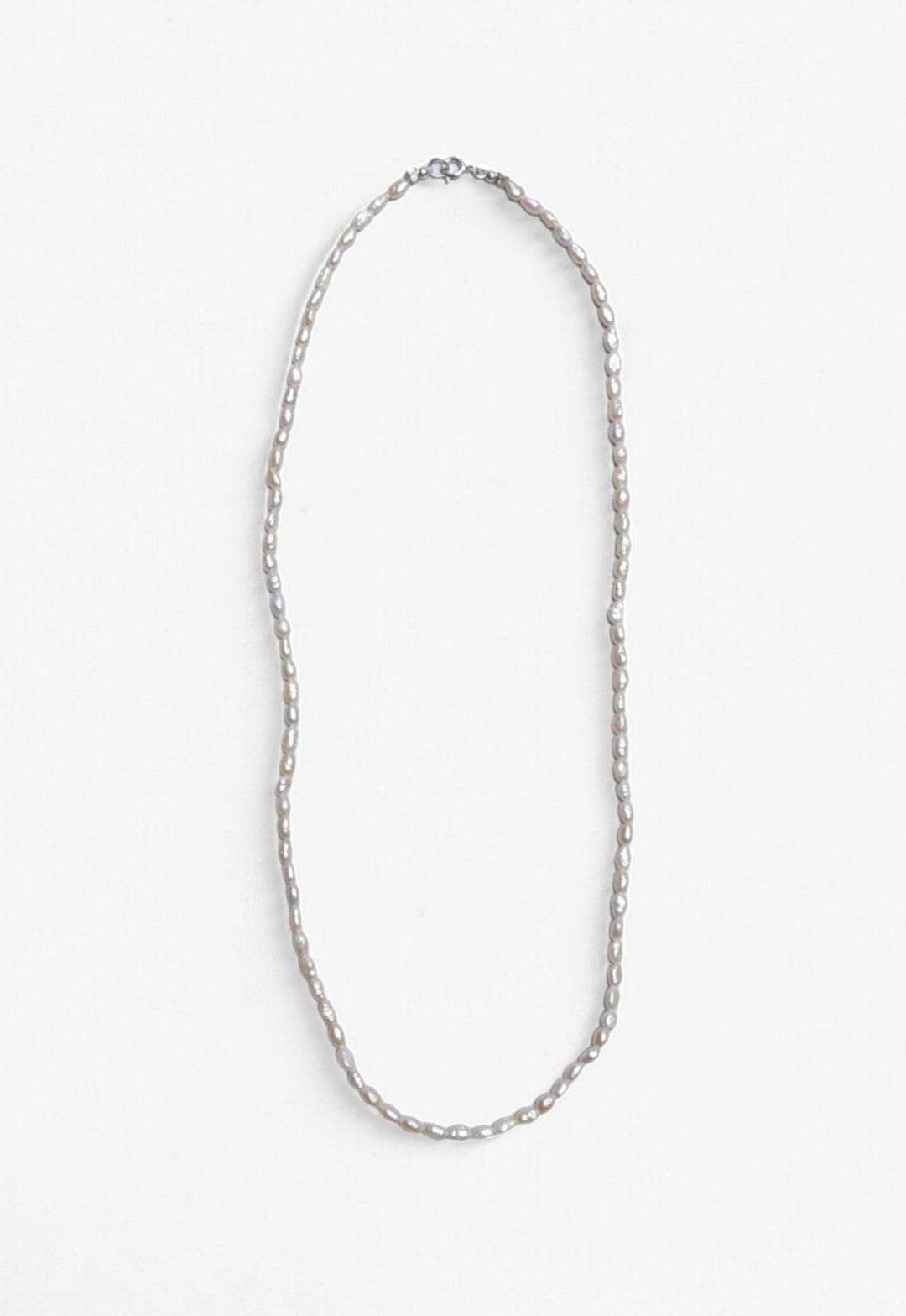 Freshwater Pearl necklace laid flat with Sterling Silver clasp.