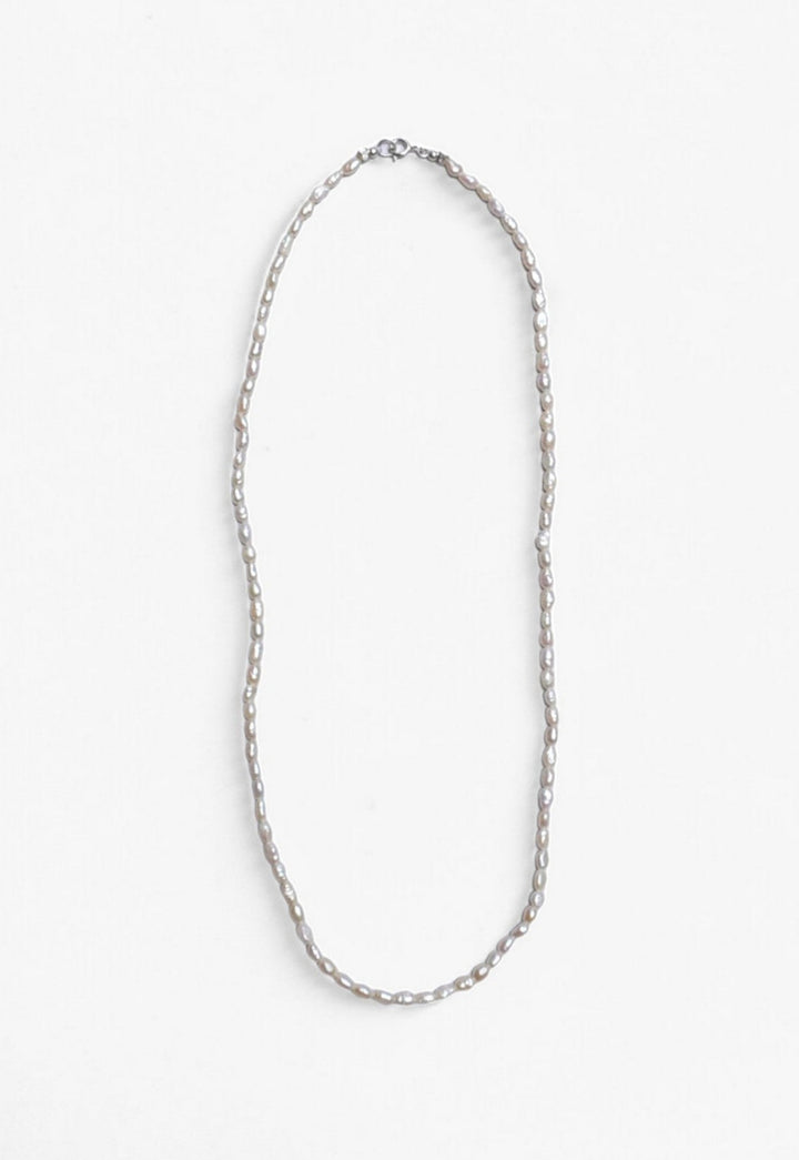 Freshwater Pearl necklace laid flat with Sterling Silver clasp.