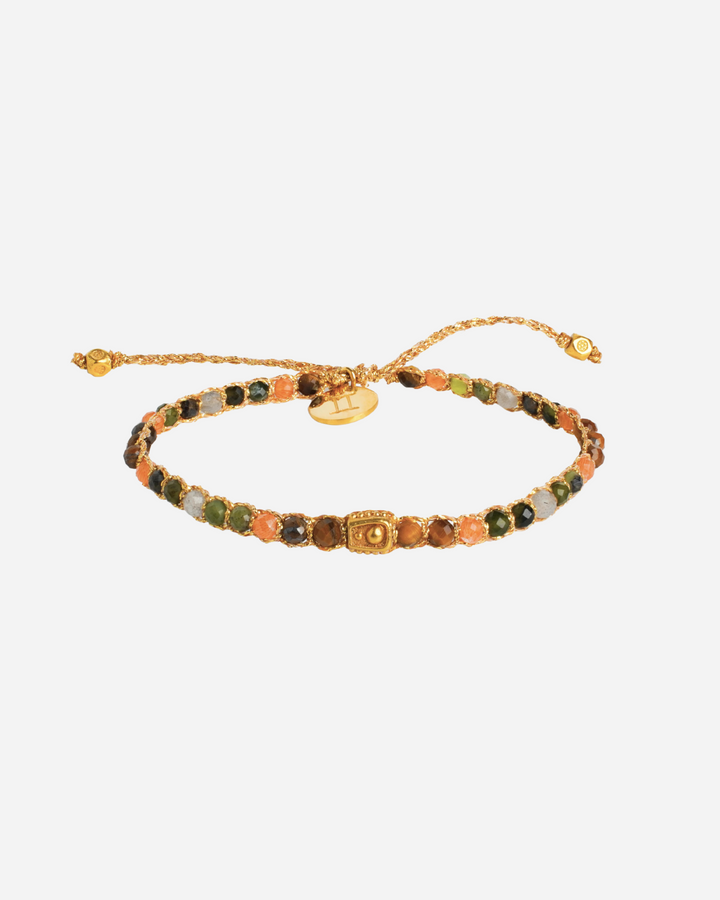 Gemini Crystal Zodiac Gemstone Bracelet with orange, brown, green, and clear gemstones woven in pure silver yarn and plated with 18k gold.