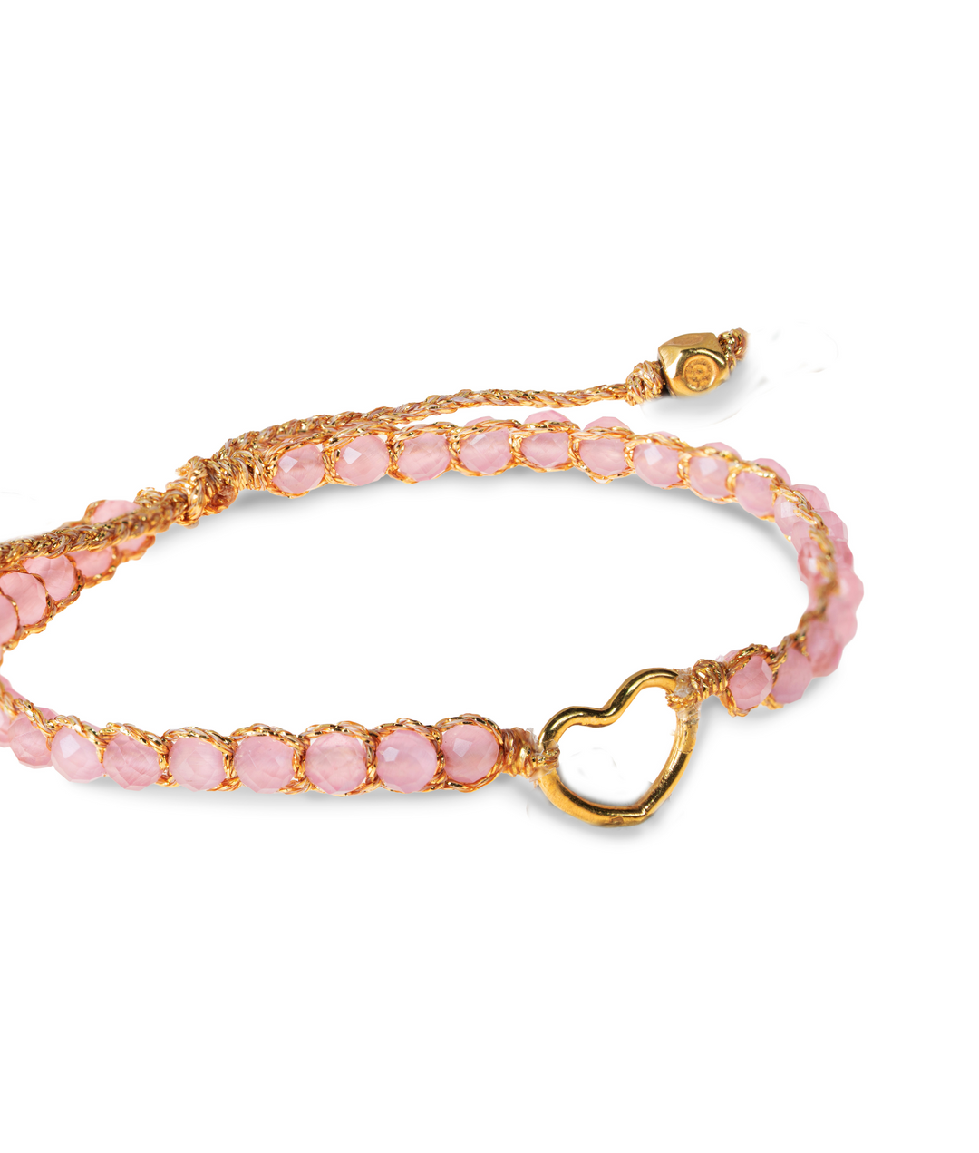 Close up of kids pink beaded gemstone bracelet with a gold heart clasp on a white background