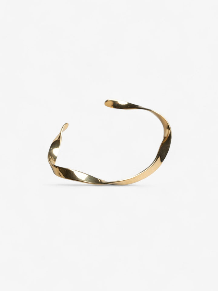 wavy gold modest cuff on its side opening at the top