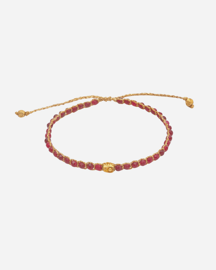 Red Aventurine Crystal Gemstone Bracelet. Adjustable bracelet strung together with red crystal gemstones and 18K Gold Yarn.