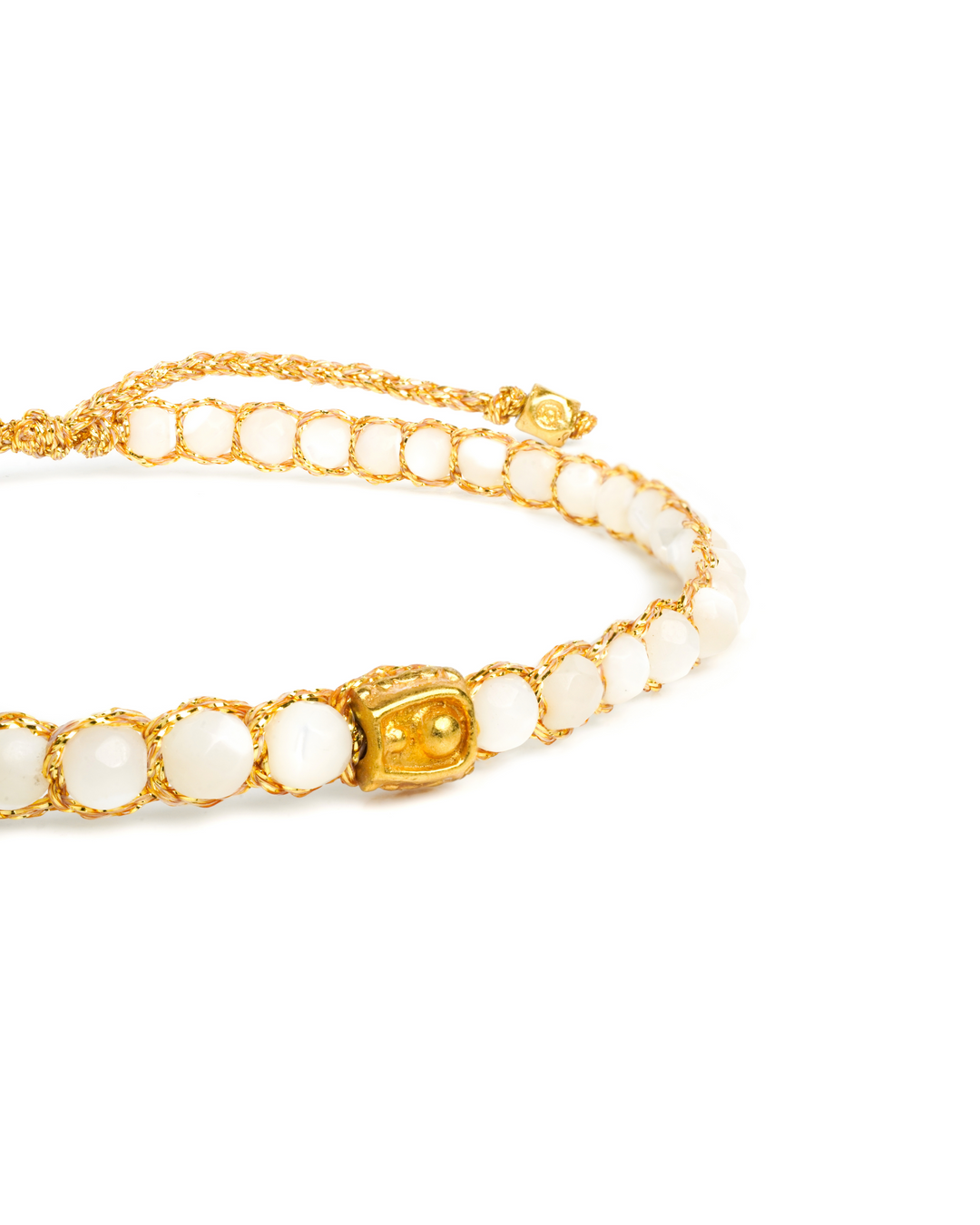 Sea Shell Gemstone Adjustable bracelet strung together with 18K Gold Yarn, close up view.