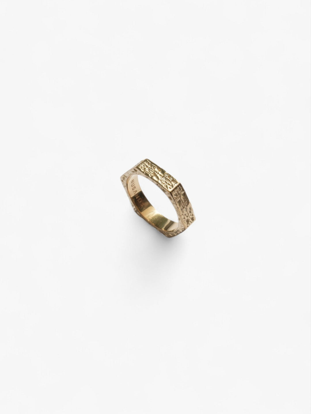 hexagon shaped 18K Gold ring standing up on its side, hammered finish - nusands six base ring.