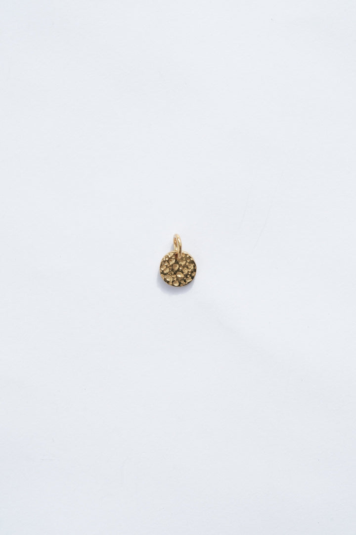 round 18k gold necklace moon charm with hammered texture zoomed out